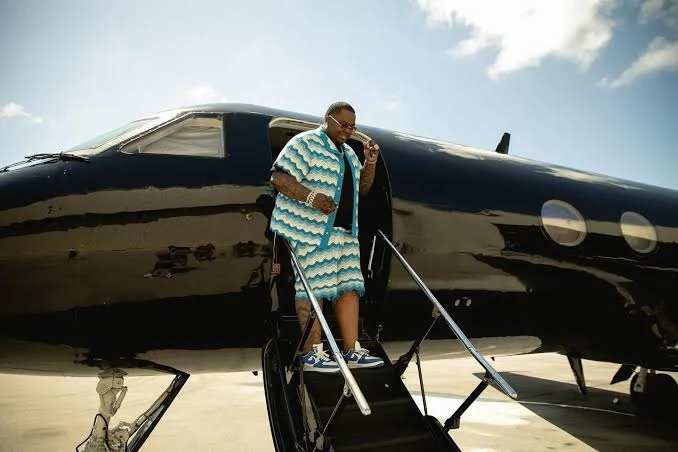 An artist standing on the steps of an aircraft