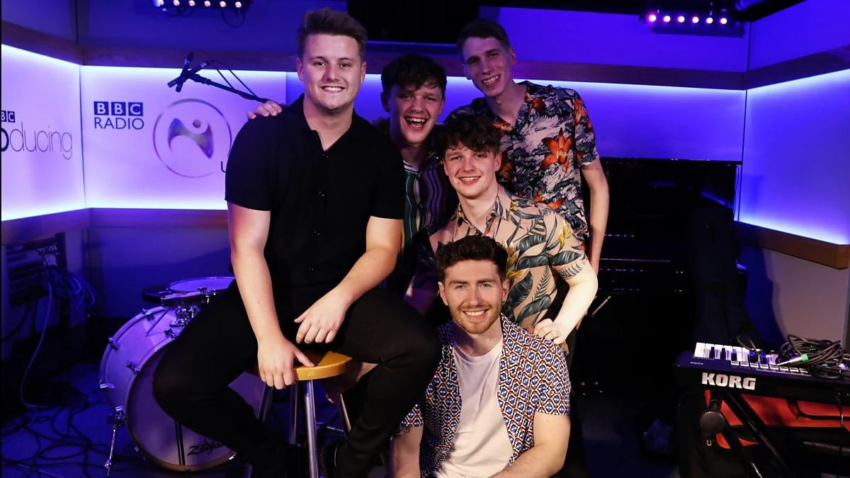 A group photographed in the BBC Radio 1 studio