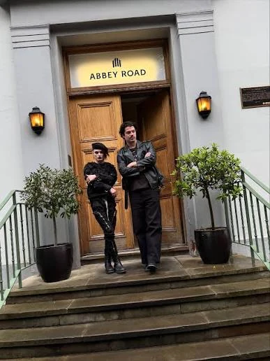 Two people outside Abbey Road Studios