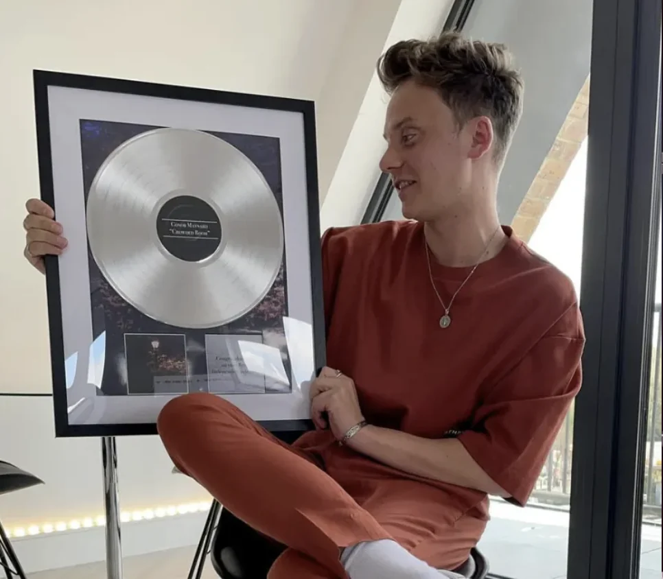 Conor Maynard holding a record award