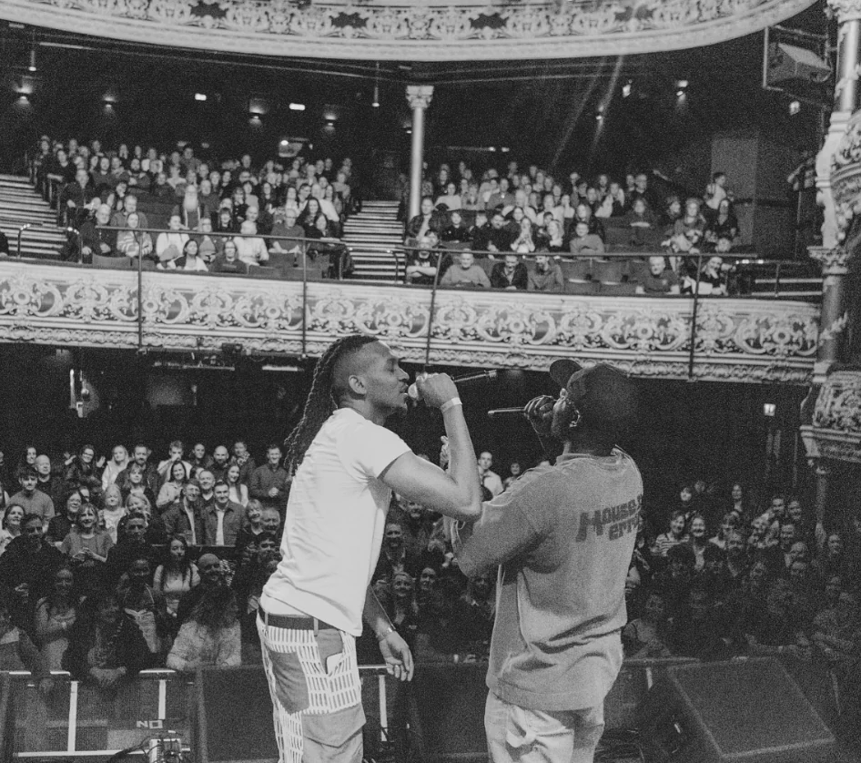 JyellowL on stage in front of an audience