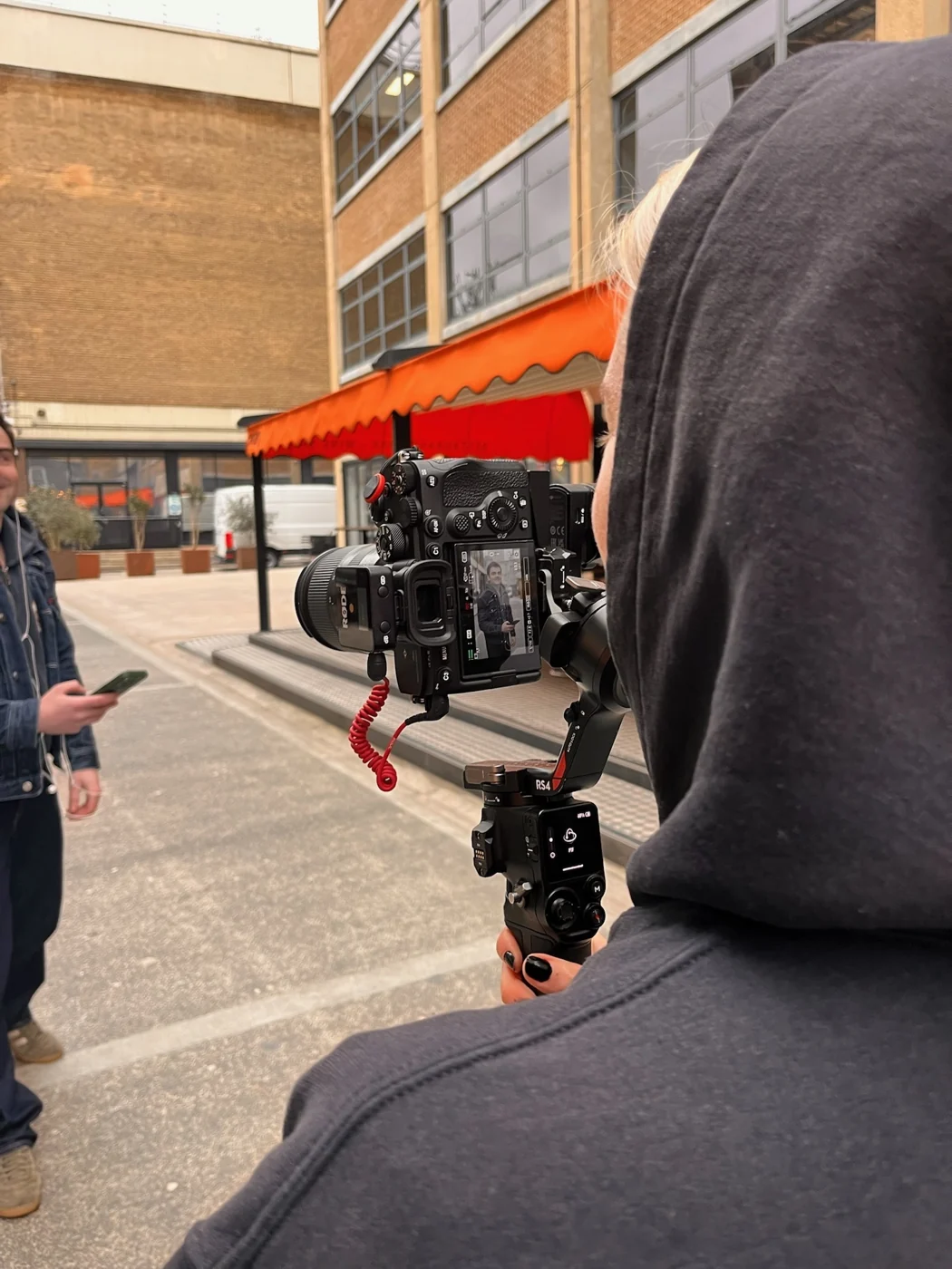 A camera filming outdoors in London