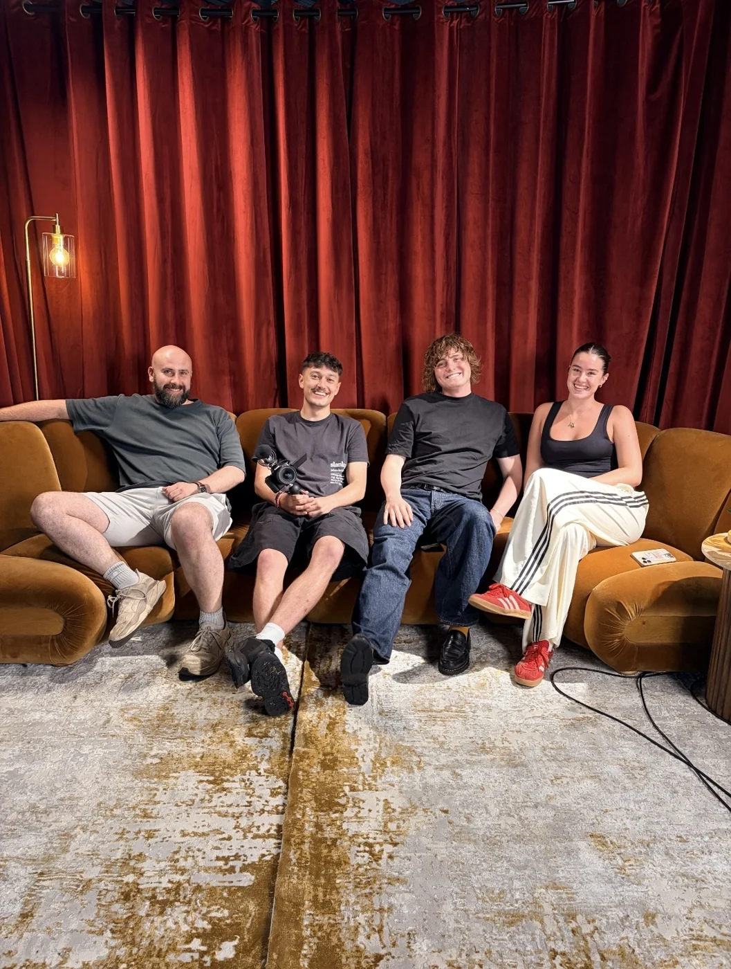 Four people sitting together after a filming session