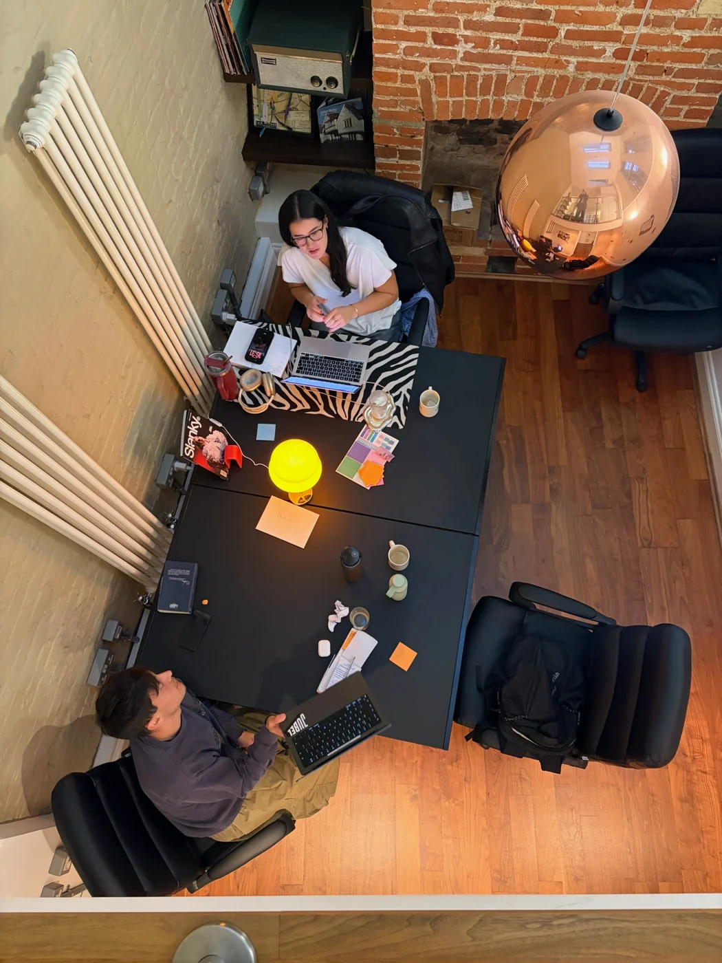 An overhead view of the team working around a table